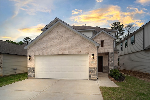 6702 Old Cypress Landing Ln, Humble, TX 77338 - view of front of home with stone siding, concrete driveway, an attached garage, and roof with shingles