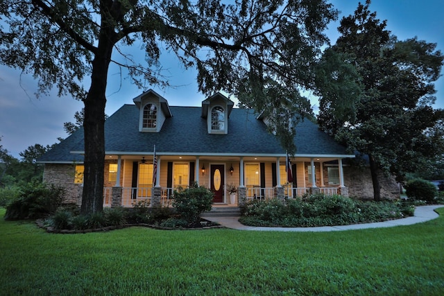 34310 High Point Dr, Magnolia, TX 77355 - view of front facade featuring stone siding and a front lawn