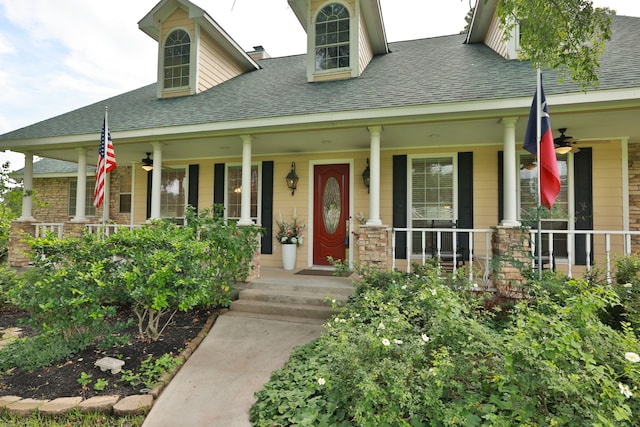 34310 High Point Dr, Magnolia, TX 77355 - view of front of house with ceiling fan, a porch, and roof with shingles