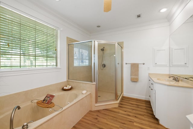 34310 High Point Dr, Magnolia, TX 77355 - full bath featuring a shower stall, a whirlpool tub, vanity, crown molding, and wood finished floors