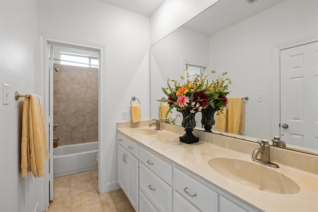 34310 High Point Dr, Magnolia, TX 77355 - full bath featuring double vanity, tile patterned flooring, and tub / shower combination