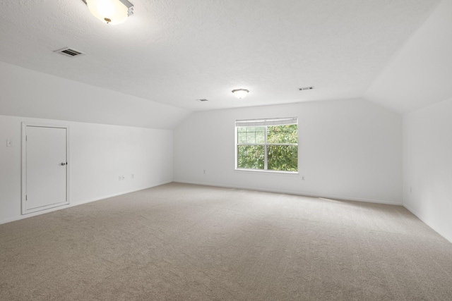 34310 High Point Dr, Magnolia, TX 77355 - bonus room featuring vaulted ceiling and light colored carpet
