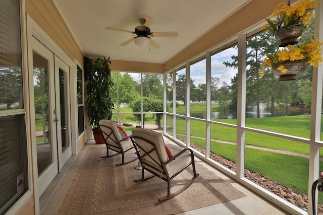 34310 High Point Dr, Magnolia, TX 77355 - sunroom / solarium with a water view, a ceiling fan, french doors, and view of scattered trees