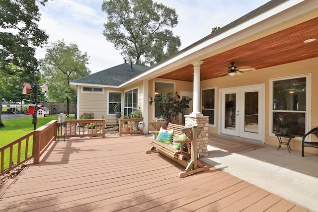 34310 High Point Dr, Magnolia, TX 77355 - deck featuring a ceiling fan, french doors, and a lawn