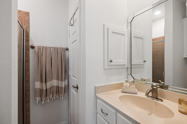 34310 High Point Dr, Magnolia, TX 77355 - bathroom featuring vanity and tiled shower