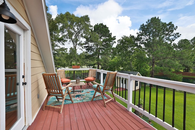 34310 High Point Dr, Magnolia, TX 77355 - wooden deck with a lawn and view of wooded area
