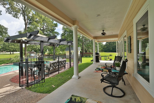 34310 High Point Dr, Magnolia, TX 77355 - view of patio / terrace featuring ceiling fan and a pergola