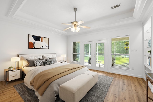 34310 High Point Dr, Magnolia, TX 77355 - bedroom with a tray ceiling, access to outside, multiple windows, french doors, and crown molding