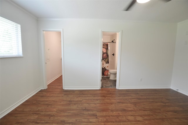 154 Wood Manor Ln, Sour Lake, TX 77659 - unfurnished bedroom featuring ornamental molding, wood finished floors, ensuite bathroom, and ceiling fan