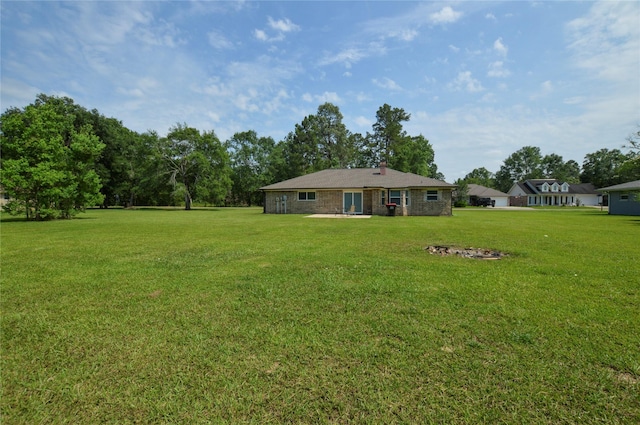 154 Wood Manor Ln, Sour Lake, TX 77659 - view of grassy yard