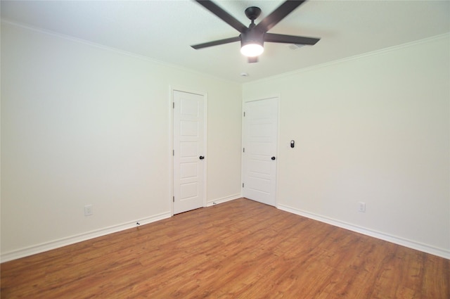 154 Wood Manor Ln, Sour Lake, TX 77659 - empty room featuring a ceiling fan, wood finished floors, and ornamental molding