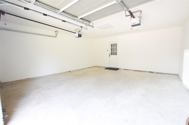 154 Wood Manor Ln, Sour Lake, TX 77659 - garage featuring a garage door opener