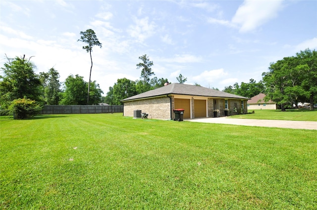 154 Wood Manor Ln, Sour Lake, TX 77659 - view of yard with driveway and an attached garage