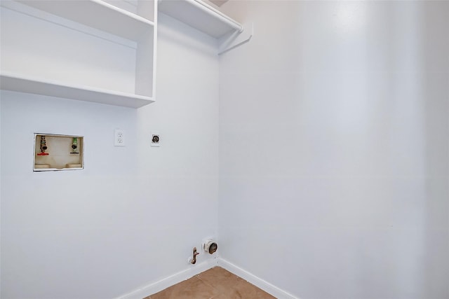 6322 Northland Dr, Houston, TX 77084 - laundry area with washer hookup, hookup for an electric dryer, light tile patterned flooring, and gas dryer hookup