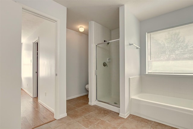 6322 Northland Dr, Houston, TX 77084 - full bath with a garden tub, a shower stall, and tile patterned flooring