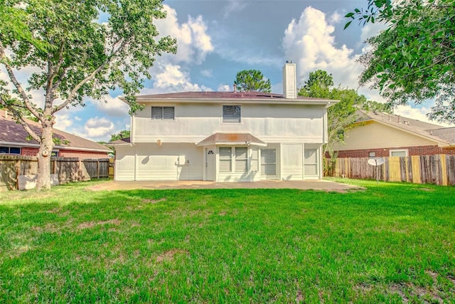 6322 Northland Dr, Houston, TX 77084 - rear view of house with a patio, a chimney, and a fenced backyard