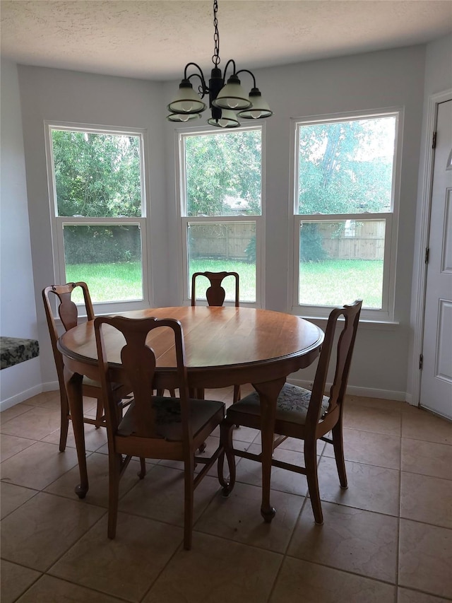 6322 Northland Dr, Houston, TX 77084 - dining room with a chandelier, plenty of natural light, and light tile patterned flooring