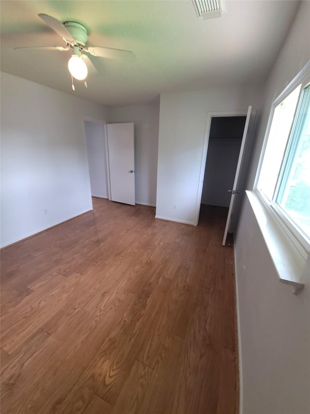 6322 Northland Dr, Houston, TX 77084 - unfurnished bedroom with wood finished floors, a ceiling fan, and a closet