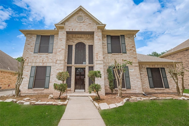 10818 Kleberg Place Dr, Houston, TX 77064 - view of front facade featuring brick siding and a front lawn