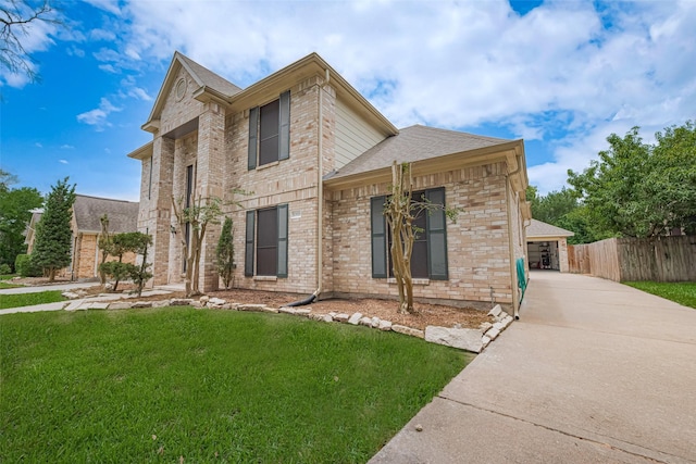 10818 Kleberg Place Dr, Houston, TX 77064 - traditional-style house with brick siding, roof with shingles, a garage, and driveway
