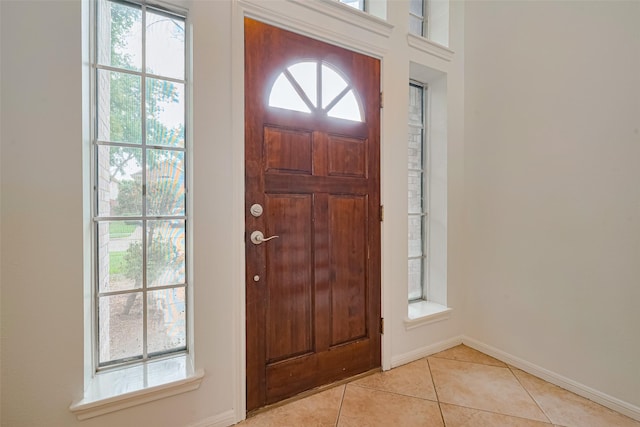 10818 Kleberg Place Dr, Houston, TX 77064 - foyer entrance with healthy amount of natural light and light tile patterned floors