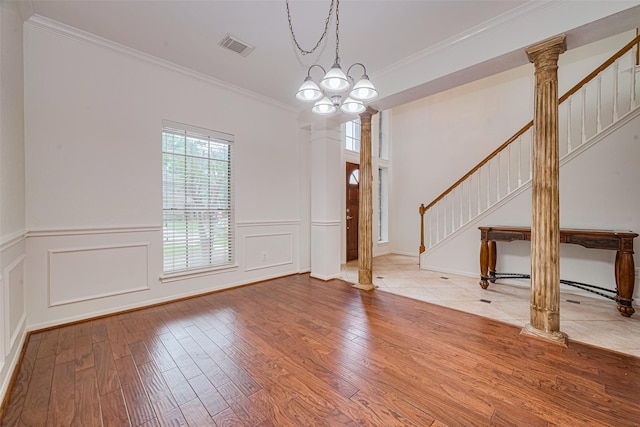 10818 Kleberg Place Dr, Houston, TX 77064 - unfurnished room featuring wood finished floors, crown molding, stairs, a decorative wall, and wainscoting