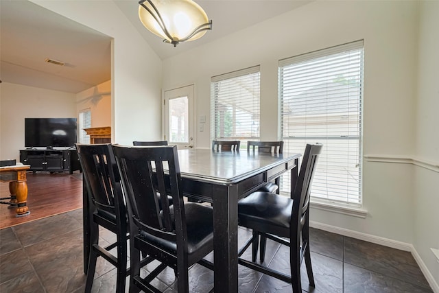 10818 Kleberg Place Dr, Houston, TX 77064 - dining area featuring lofted ceiling and baseboards