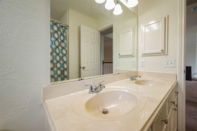 10818 Kleberg Place Dr, Houston, TX 77064 - full bath with a textured wall and double vanity