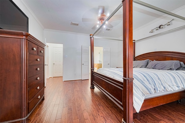10818 Kleberg Place Dr, Houston, TX 77064 - bedroom with crown molding, dark wood finished floors, a ceiling fan, and ensuite bath