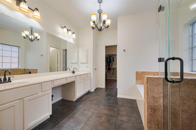 10818 Kleberg Place Dr, Houston, TX 77064 - full bath featuring a chandelier, double vanity, a garden tub, a stall shower, and a walk in closet