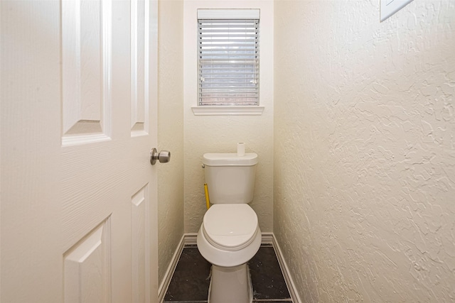 10818 Kleberg Place Dr, Houston, TX 77064 - bathroom featuring baseboards and a textured wall
