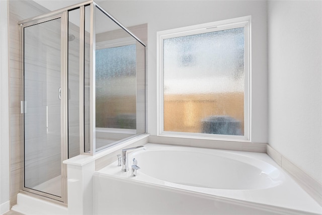304 E Tranquil Fields Ln, Waller, TX 77484 - full bathroom featuring a shower stall and a garden tub