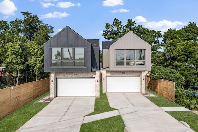 4110 Cortlandt St, Houston, TX 77018 - view of front of home featuring concrete driveway, a garage, brick siding, and board and batten siding