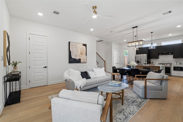 4110 Cortlandt St, Houston, TX 77018 - living room featuring stairway, light wood finished floors, ceiling fan, and recessed lighting