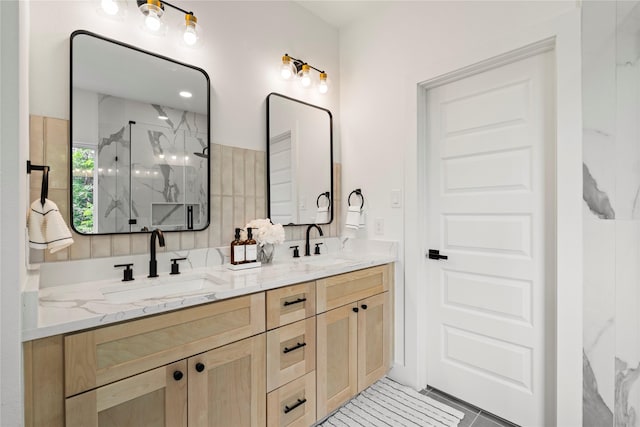 4110 Cortlandt St, Houston, TX 77018 - bathroom featuring a marble finish shower, double vanity, and tile patterned flooring
