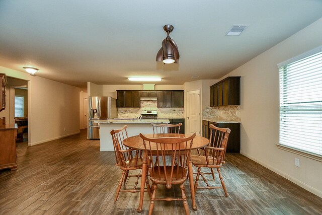 2026 Naplechase Crest Dr, Spring, TX 77373 - dining space featuring dark wood-style flooring and a fireplace