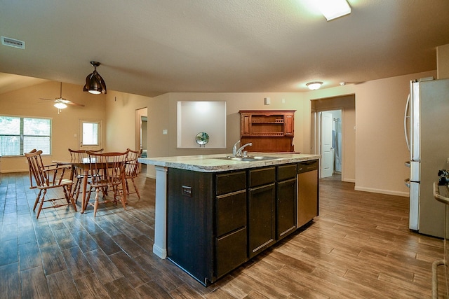 2026 Naplechase Crest Dr, Spring, TX 77373 - kitchen featuring stainless steel appliances, a ceiling fan, dark wood finished floors, and a kitchen island with sink