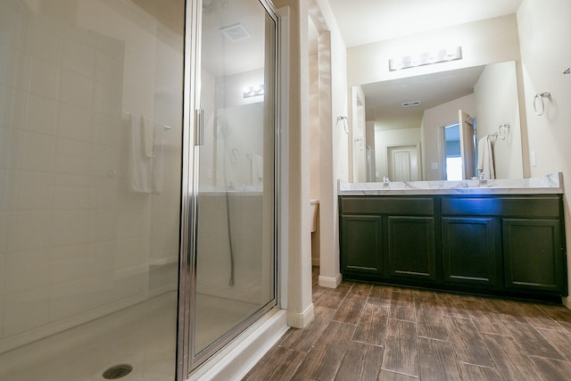2026 Naplechase Crest Dr, Spring, TX 77373 - full bath featuring a stall shower, wood tiled floors, and double vanity