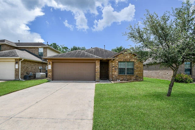 2026 Naplechase Crest Dr, Spring, TX 77373 - view of front of property with an attached garage, driveway, a front lawn, and brick siding