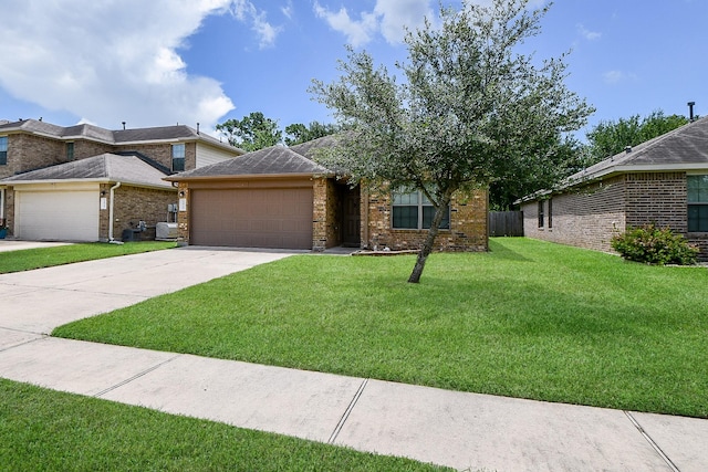 2026 Naplechase Crest Dr, Spring, TX 77373 - view of front of property with a garage, concrete driveway, and brick siding