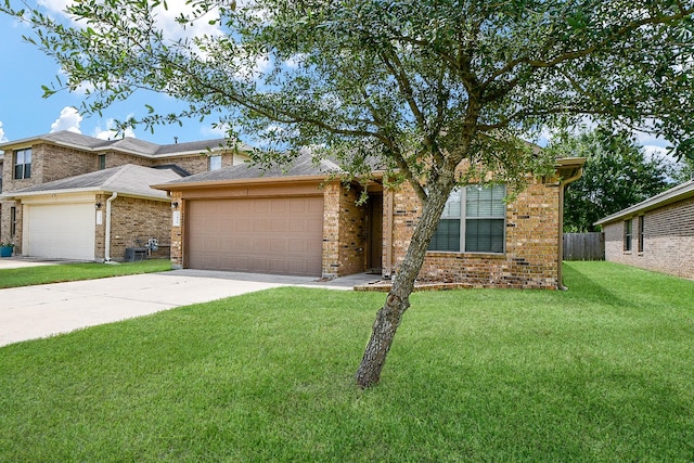2026 Naplechase Crest Dr, Spring, TX 77373 - view of front facade featuring an attached garage, driveway, and brick siding