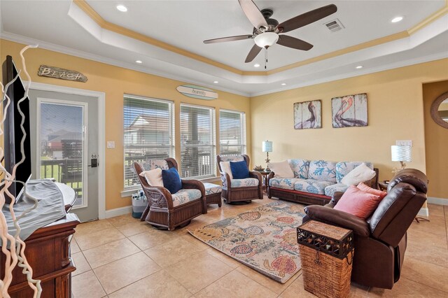 2617 Breaker Dr, Port Bolivar, TX 77650 - living room with a tray ceiling, ceiling fan, crown molding, light tile patterned floors, and recessed lighting