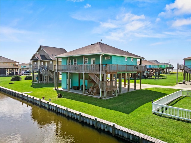 2617 Breaker Dr, Port Bolivar, TX 77650 - back of house with stairs, a deck with water view, a patio, a shingled roof, and a residential view