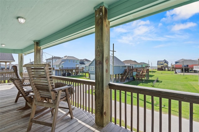 2617 Breaker Dr, Port Bolivar, TX 77650 - wooden deck featuring a residential view and a yard