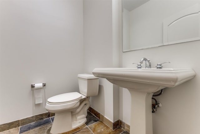 1616 Fountain View Dr Unit 202, Houston, TX 77057 - half bath with stone tile flooring and toilet