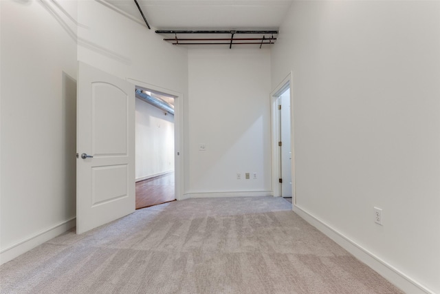 1616 Fountain View Dr Unit 202, Houston, TX 77057 - spare room featuring carpet flooring and a high ceiling