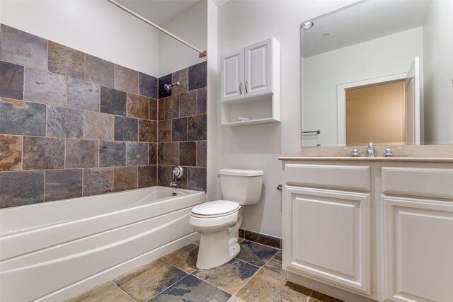 1616 Fountain View Dr Unit 202, Houston, TX 77057 - bathroom featuring shower / washtub combination, vanity, and stone tile floors