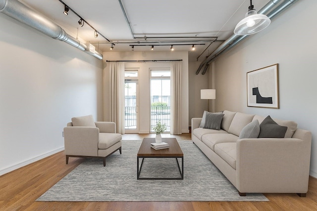 1616 Fountain View Dr Unit 202, Houston, TX 77057 - living room featuring track lighting and wood finished floors