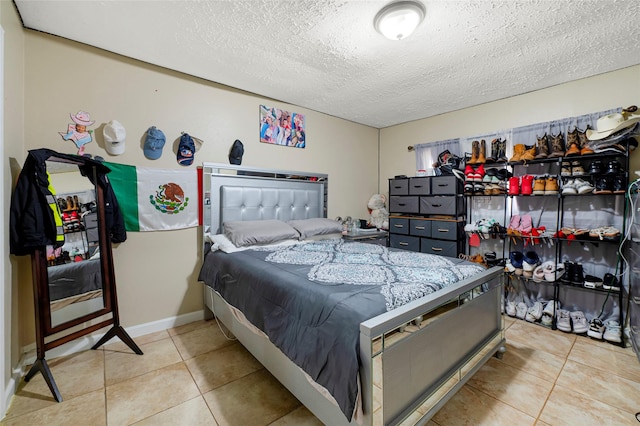 19330 Cypress Canyon Dr, Katy, TX 77449 - tiled bedroom featuring a textured ceiling