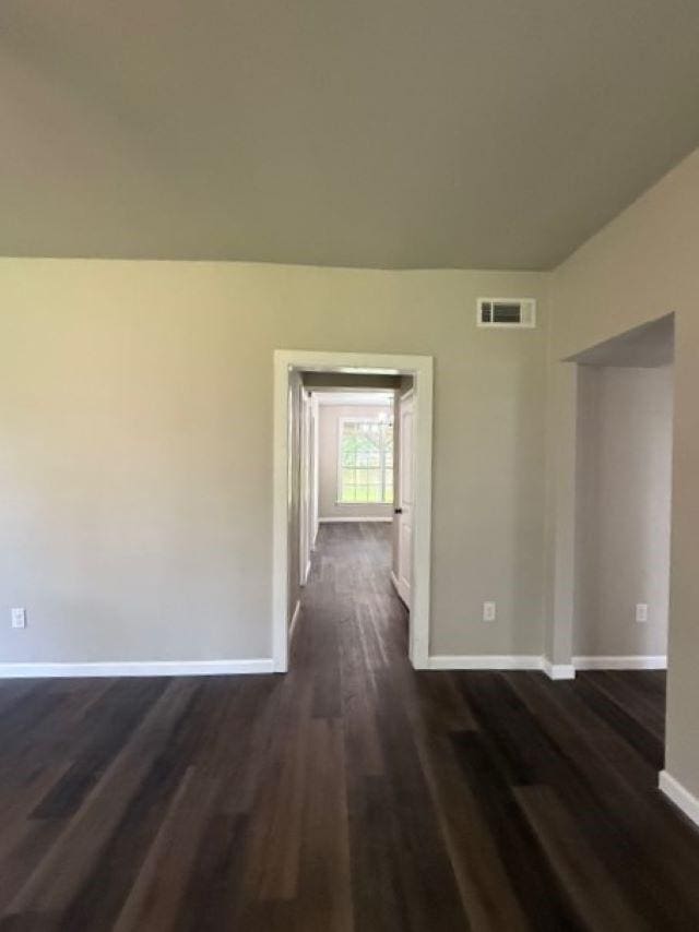 403 3rd St, Nederland, TX 77627 - unfurnished room with dark wood-type flooring and baseboards